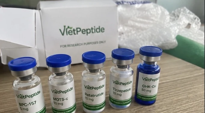 A received VietPeptide order with labeled vials and packaging